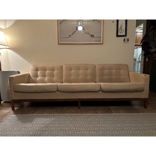 Florence Knoll/Knoll International Sofa Set. One three cushion, one two cushion. Original 1950s sofas with walnut bases....