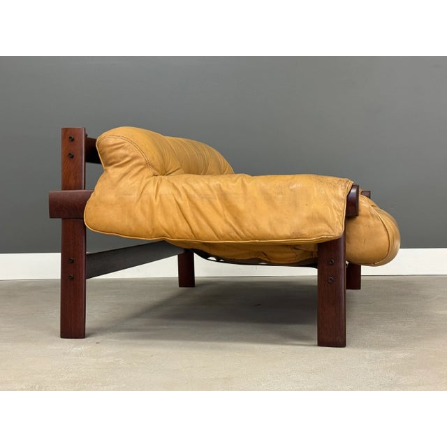 A beautiful mid century modern solid jacaranda yellow leather loveseat sofa designed by Percival Lafer MP-41. Made in...