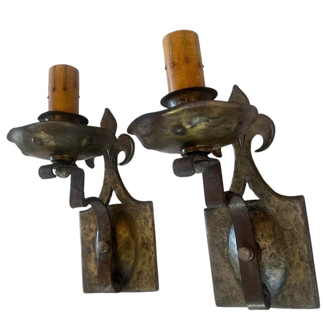 These are just a great quality pair of mixed metal sconces with original patina. The embossing on the fleur de lis is...