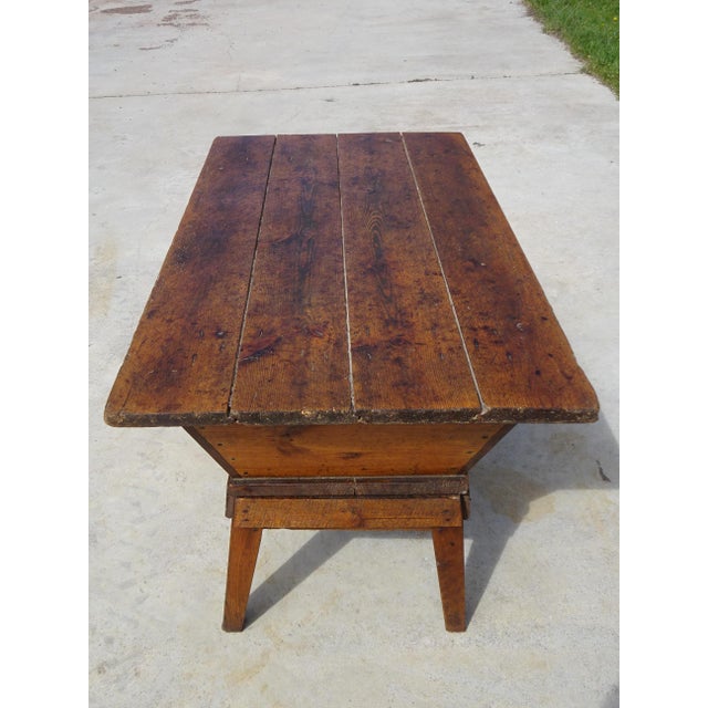 A 19th-century kneading trough on a removable stand with a lid, made entirely of solid oak. The rustic, pegged base...