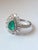 A very beautiful and one of a kind, Emerald Engagement Ring set in 18K White Gold & Diamonds. The weight of the Emerald us...