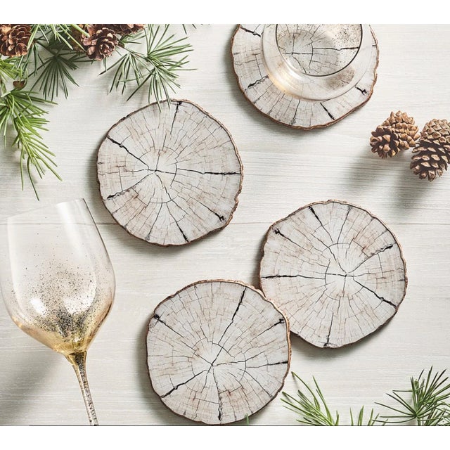Sold at Bergdorf Goodman, these Kim Seybert 4 birch coasters and 1 matching placemat are in excellent condition. "The...