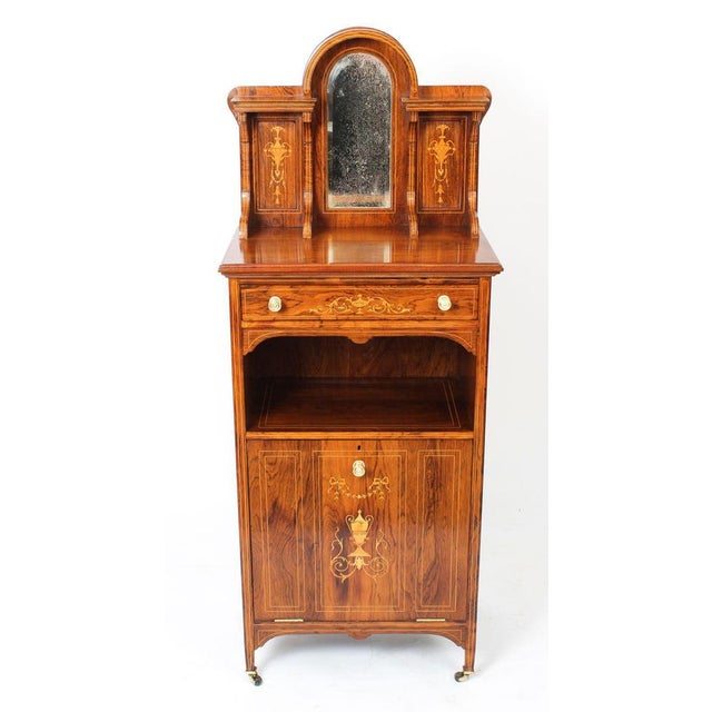 This is a beautiful antique Gonçalo alves and boxwood marquetry inlaid music cabinet, circa 1880 in date. The rectangular...