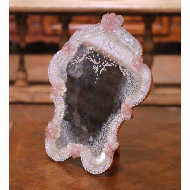 This elegant antique table mirror was created in Murano, Italy circa 1960 and reflects the refined tradition of Venetian...