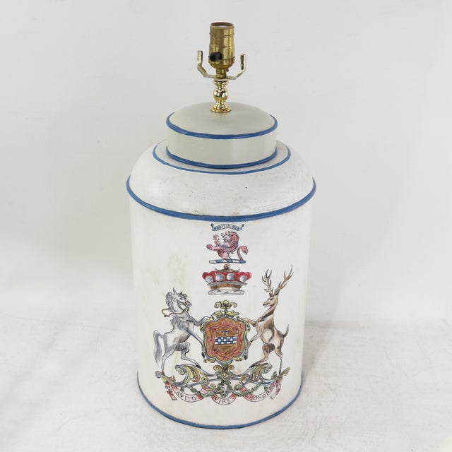 This sophisticated vintage hand-painted tole table lamp features a classic cylindrical tea caddy silhouette in a crisp...