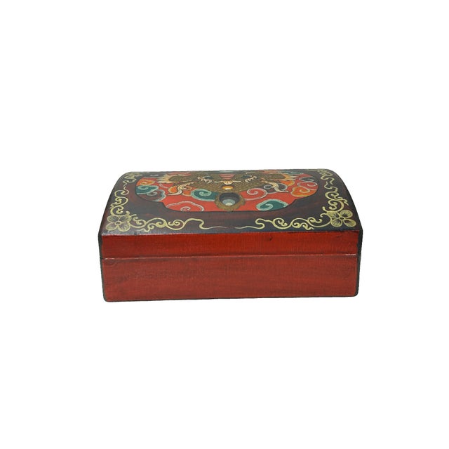 This vibrant, hand-painted wooden chest features a striking central medallion of a Kirin, rendered in rich gold and earthy...