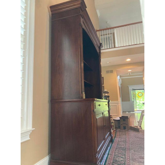A stunning and increasingly hard-to-find Ethan Allen British Classics entertainment cabinet featuring a concealed...