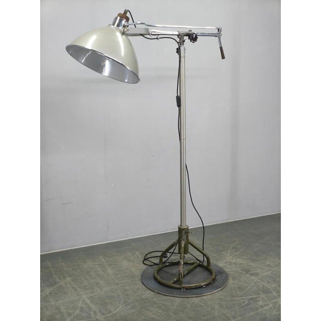 Exceptional industrial floor lamp created from an original unused military field hospital operating light produced in...