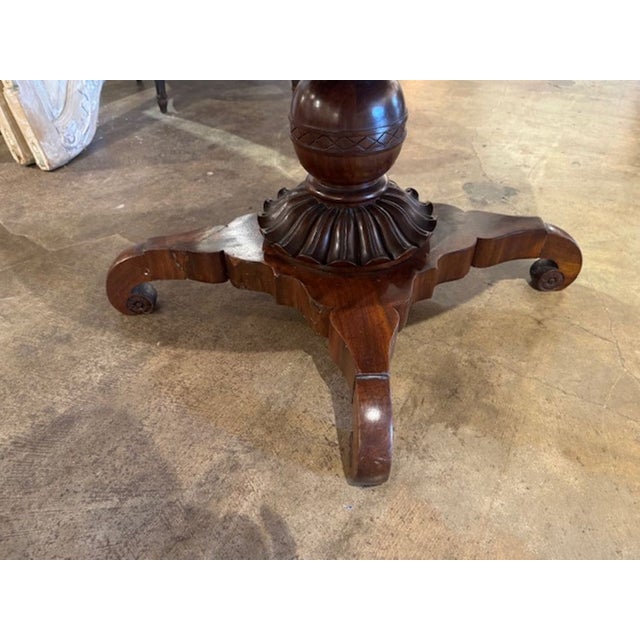 Handsome 19th century Italian flame mahogany carved center table. Circa 1870. Adds warmth and charm to any room! 28h x 39.5w