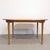 Elegant vintage Imexcotra extendable dining table from the 1960s. The table features a softly shaped oval top with a warm...