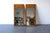 Stunning pair of Mid-Century Modern wall mirrors featuring bookmatched burl wood frames with a warm, honey-toned grain and...