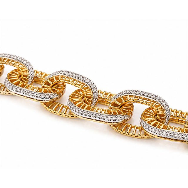 This striking designer necklace is crafted in 10K yellow gold and set with 7 5/8 carats total weight of natural diamonds,...