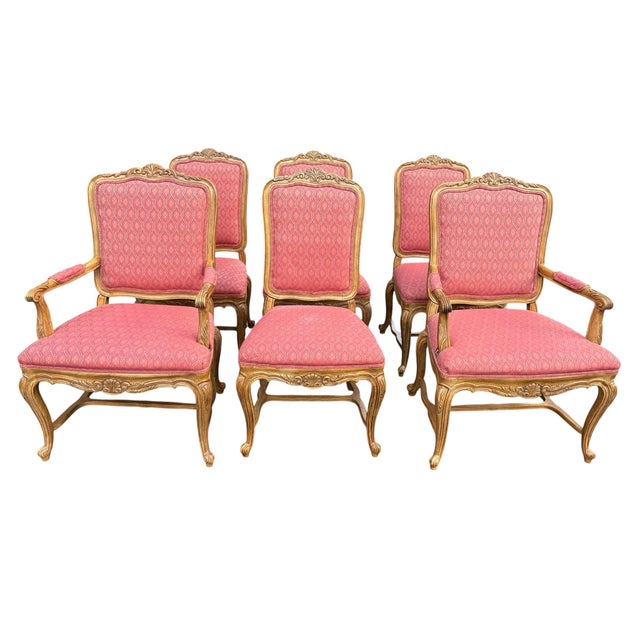 A set of 2 arm chairs and 4 armless chairs French wood upholstered chairs made by Drexel Heritage. Tag underside. The...