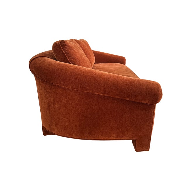 Sculptural postmodern sofa, circa 1980s. Newly upholstered in a rich burnt cinnamon/terracotta Italian chenille....