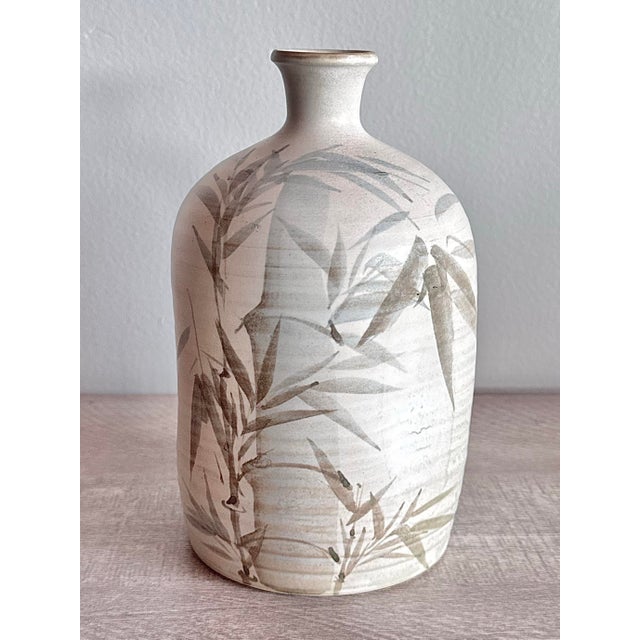 Vintage Kiyomizu Wear Ceramic Sake Bottle – Hand-Painted Bamboo Motif A beautiful vintage Japanese ceramic sake bottle by...