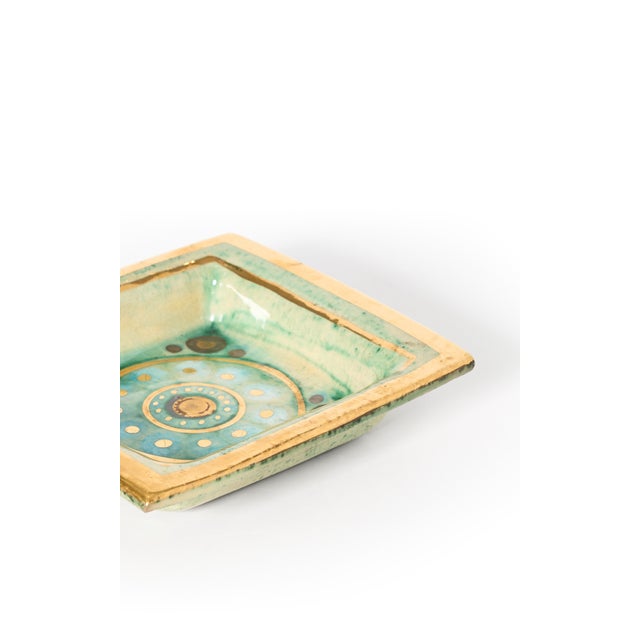 Gorgeous and highly collectible lusterware mid-century modern dish in green and aqua hues by master ceramicist Georges...