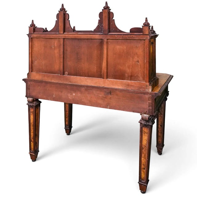 This Antique French Burr Walnut & Mahogany Carved Wood Writing Desk exudes vintage charm with its rich brown color and...