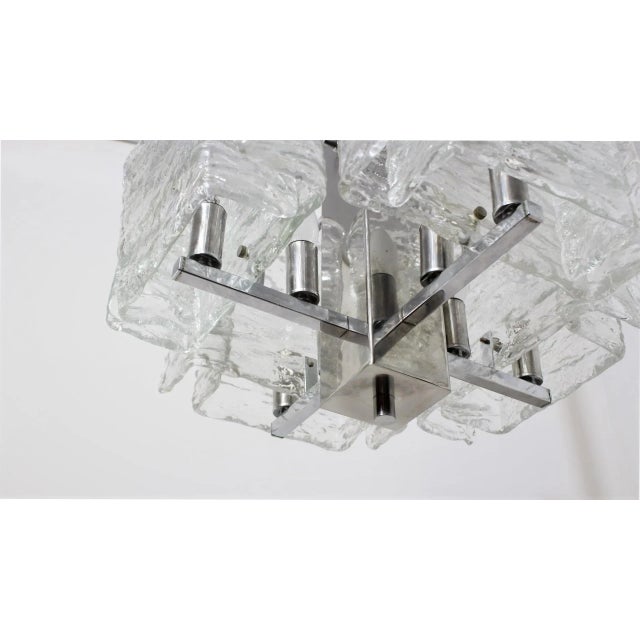 Elegant italian glass pendant chandelier by mazzega 1970s. It has metal chrome structure with squared murano glass panels...