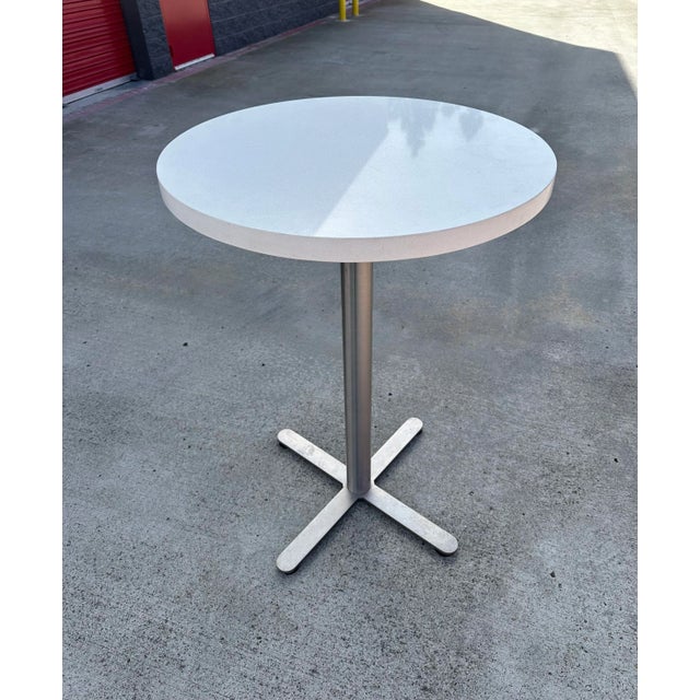 The combination of the quartz top and chrome pedestal base gives a modern vibe, perfect for a chic bar or kitchen area....
