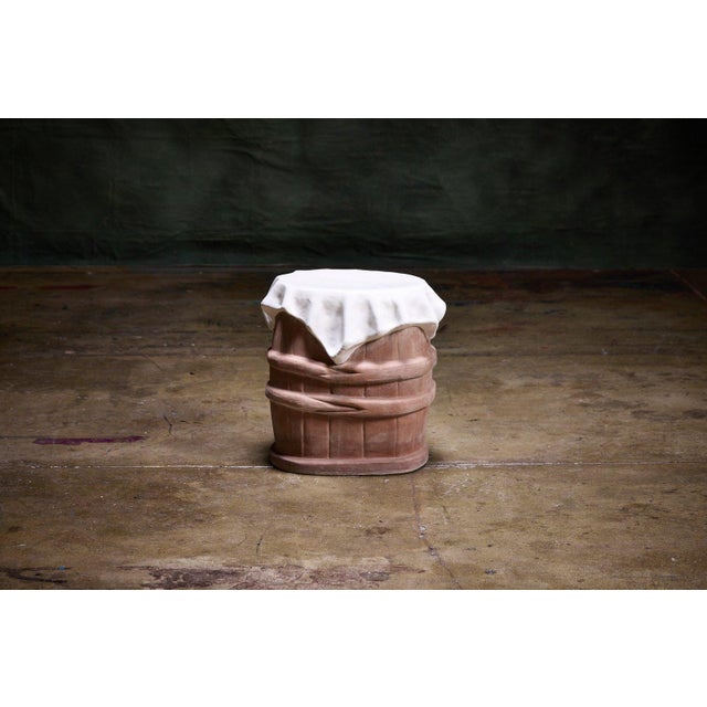 Italian Trompe l'Oeil Garden Table designed to mimic a draped cloth over a barrel base executed in terracotta and glazed...