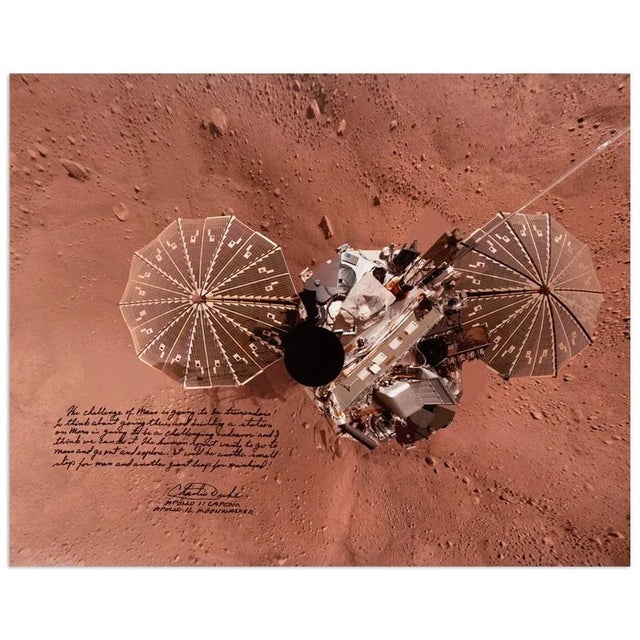 Presented is a photograph of the Phoenix Lander on Mars, signed and inscribed by Apollo 16 moonwalker Charlie Duke. In the...