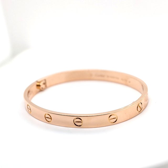 This is a newly serviced Cartier Love Bracelet in 18k Rose Gold. It is a size 7. It comes with the original box and...