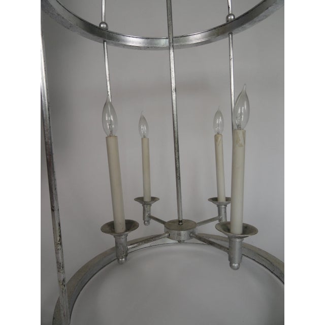 Late 20th century metal and mirror four-light chandelier in silver-leaf finish. 46" high. Large scale.