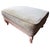 A generously scaled and beautifully appointed Louis XV style ottoman with a carved cream painted hardwood frame. The...