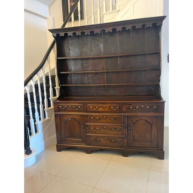 Antique George III outstanding quality oak Welsh dresser and original plate rack having an outstanding quality oak plate...