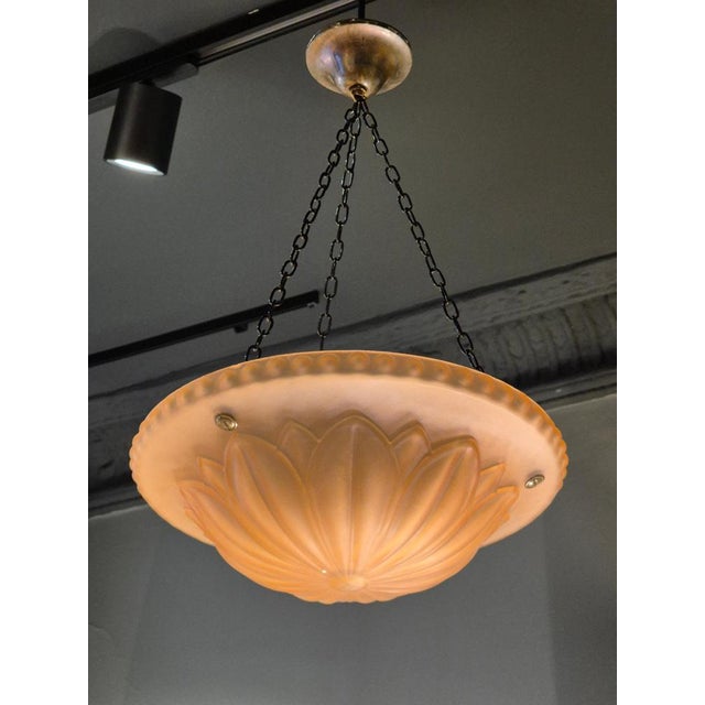 A beautiful and decorative pendant in Havanna colored glass with petal decor. Designed by Harald Notini for Böhlmarks...
