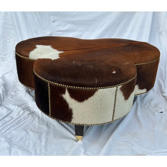 Animal Skin Vintage Cloverleaf Cowhide Ottoman With Brass Casters & Nailhead Trim For Sale - Image 7 of 7