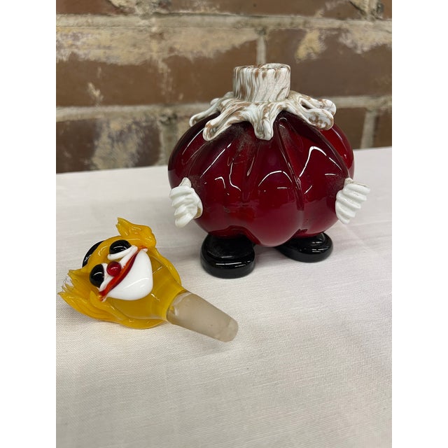 This Murano figure is a hand blown art glass clown decanter complete with a removable head stopper. It was crafted in...