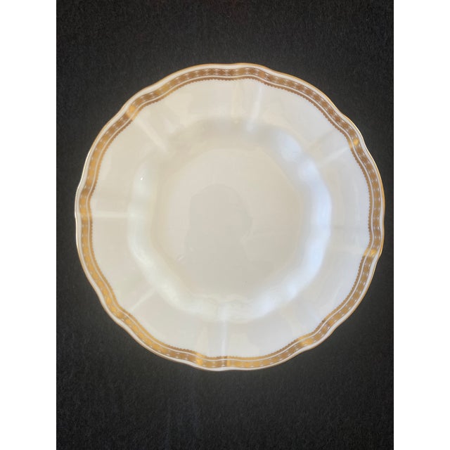 Lovely scalloped dessert plates with gold detailing by Royal Crown Derby.