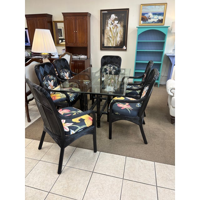 Vintage McGuire bamboo black table with newly lacquered black reed chairs to enhance the palm beach regency style....