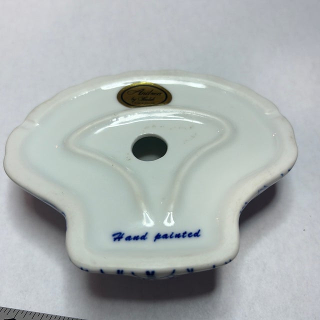 Andrea by Sadek hand painted blue fishnet pattern on a white ceramic shell