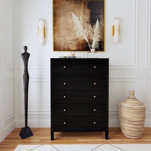 Elevate your space with the timeless charm and functional elegance of the Butler Specialty Company Nora 5 Drawer Tall...