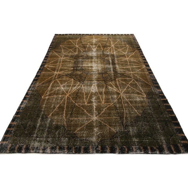 Hand knotted in wool originating from Turkey circa 1960-1970, a vintage 7x11 Art Deco rug from our Mid-Century Pasha...