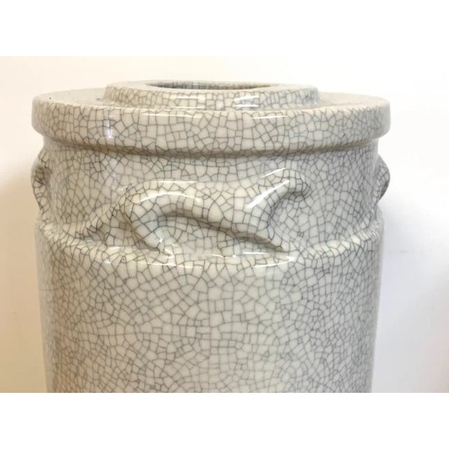 French Modern Crackle Glaze Jaguar Motif Vase, With all over crackle glaze, the upper part with a continuous ring of...