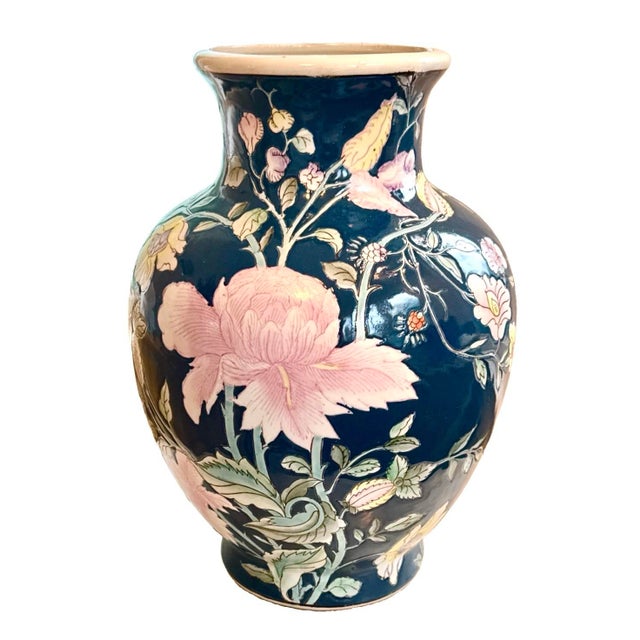 Vintage Chinoiserie-style ceramic vase with a deep teal / blue background and hand-painted pink and yellow floral peony...