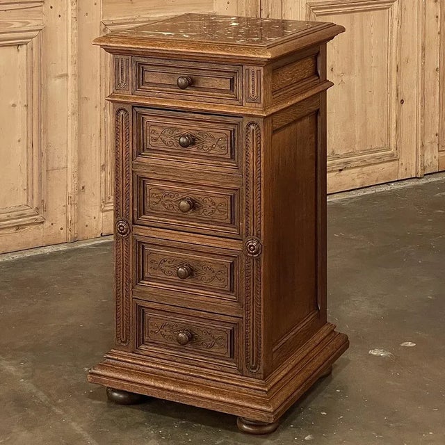 19th Century French Neoclassical Marble Top Nightstand was fashioned from solid oak, and features tailored architecture...