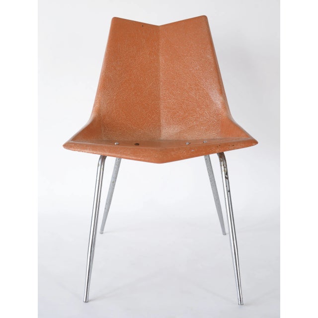 Mid century modern fiberglass chair designed by Paul McCobb for St. John Seating Corporation in the 1950s. This version...