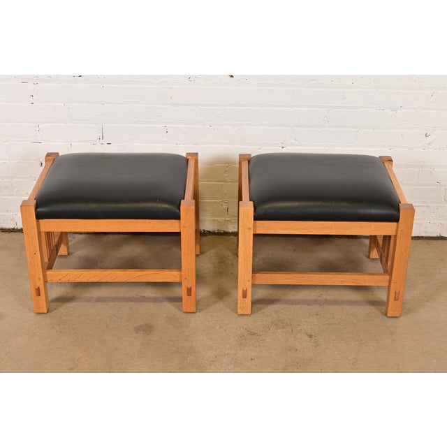 An exceptional pair of Mission or Arts & Crafts stools, benches, or ottomans By L. & J.G. Stickley USA, Late 20th Century...