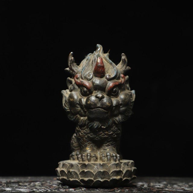 This is an exquisite antique Chinese bronze figure of a Qilin (a mythical beast also known as a year beast), sourced from...