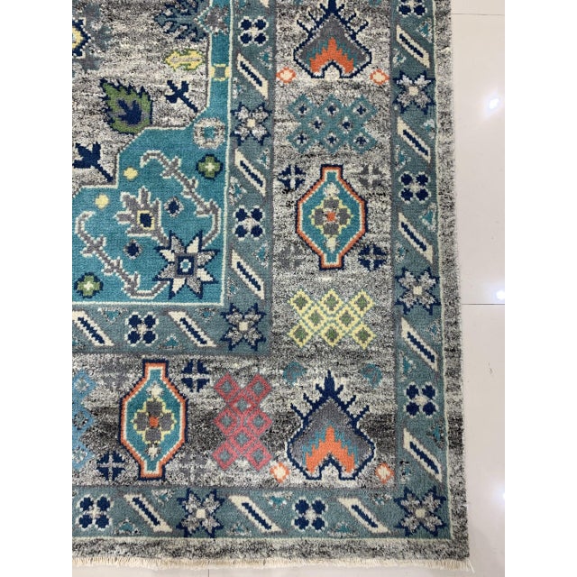 Jasmine Radiant Gray Hand Knotted Wool Rug, Country of Origin: India. This exceptional piece showcases the enduring...