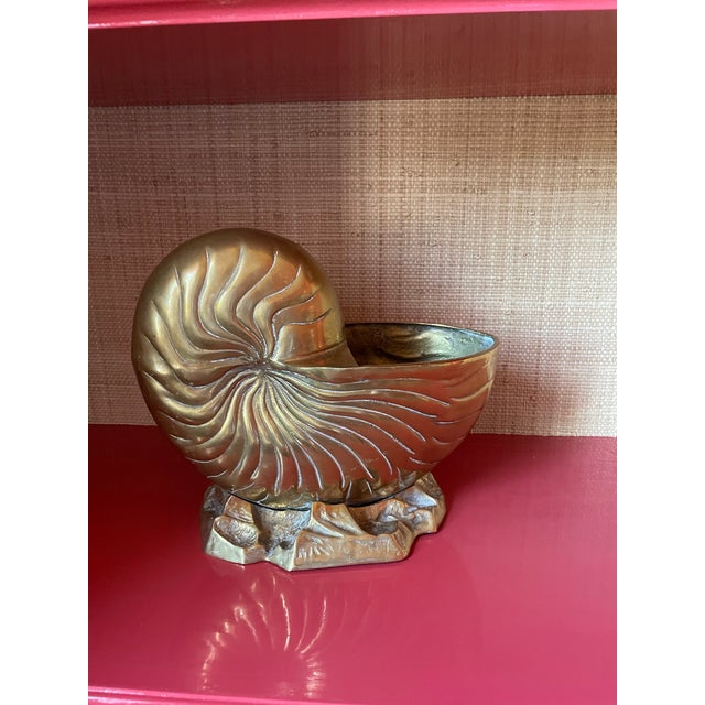This vintage piece has been used as a wine cooler but could also be a cachepot for your orchids! It's in the shape of a...