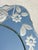 An elegant antique glass mirror featuring a refined silhouette and finely acid-etched floral ornamentation on its frame....