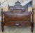 An Exquisite antique French Louis XVI full size bed. Made of Rosewood featuring foliate carved ribbon and crest with...