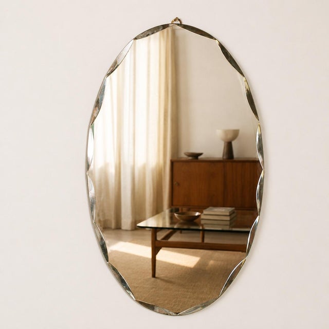 Elegant italian mid-century wall mirror produced by fontana arte in the 1950s, retaining its original label on the...