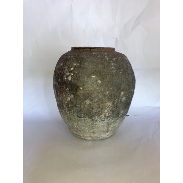 Thick-walled, with a textured finish outside and around the rim. Vessels such as this were used during the Ming Dynasty to...