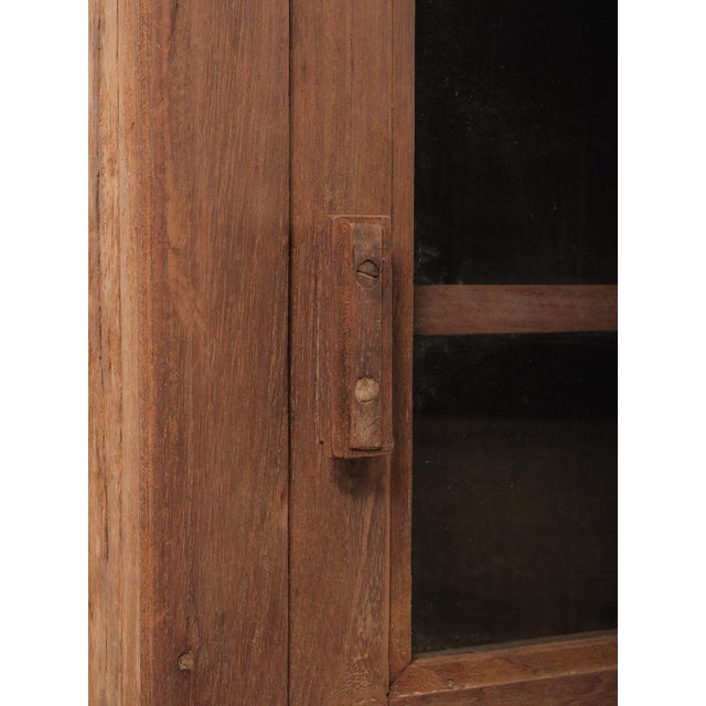 Late 20th Century Indian Teak Wood Wall Cabinet With Glass Doors and Original Hardware For Sale - Image 4 of 6
